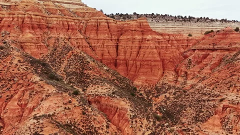 Bright red rocks show canyon layers and shapes in Texas landscape during daytime Stock Footage 331977981