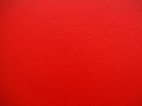 A bright red rough wal Stock Photos