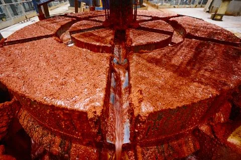 Bright red solid residual of sylvinite in floatation bath Stock Photos