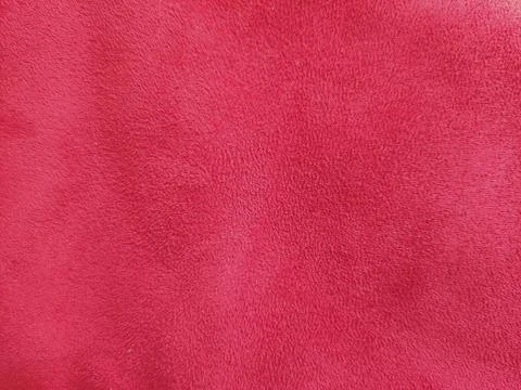 Bright red texture or background of smooth fabric material Stock Photos