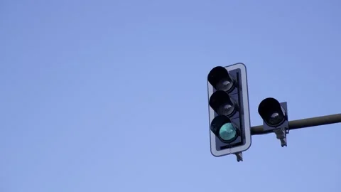 A bright red traffic light, symbolizing the need to stop, stands out prominently Stock Footage 304941172