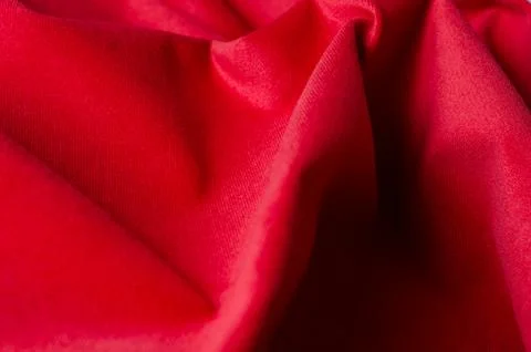 Bright red velour textile sample. Fabric texture background Stock Photos