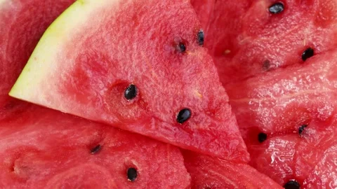 Bright red watermelon slices circle rotation close up Stock Footage 290872301