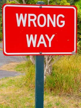 Bright Red ‘Wrong Way’ Road Sign Close-Up Stock Photos