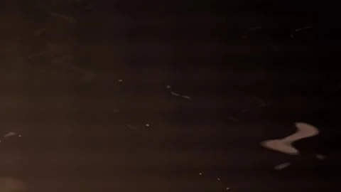 Bright rippling rays of light against a dark background. Stock Footage 250560841