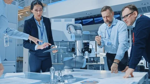 In the Bright Robotic Industry Engineering Facility Robot Arm Picks Up Detail Stock Footage 105355907