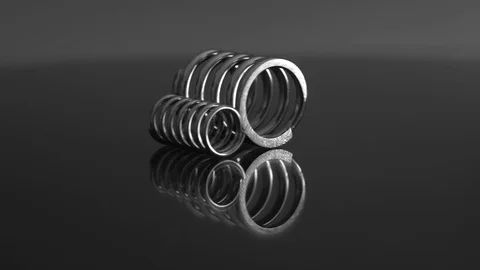 Bright rolling springs on a reflecting surface Stock Footage 83798177