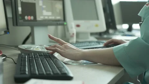 Bright room for computed tomography. Medic operator typing on the keyboard Stock Footage 163367107
