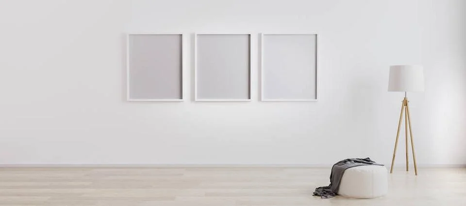 Bright room interior with three empty frames for mockup with wooden floor ... Foto stock