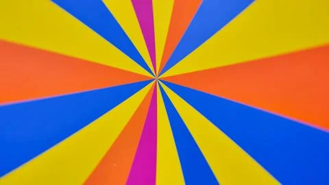 Bright rotating multicolored stripes on the wheel. Vibrant Radial Pattern with Stock Photos