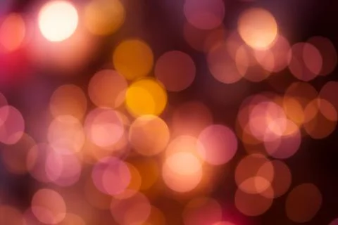 Bright round bokeh on vivid ruby red color background Stock Photos