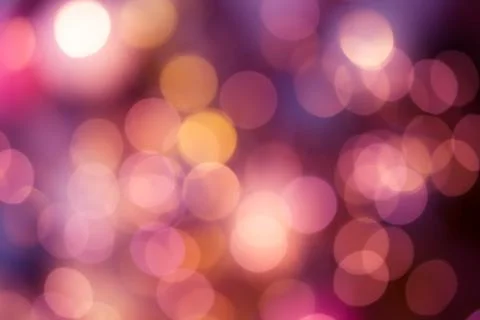 Bright round bokeh on vivid ruby red color background Stock Photos
