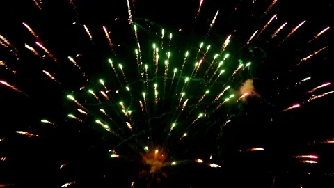 A bright salute flashes in the dark sky Stock Footage 100346052
