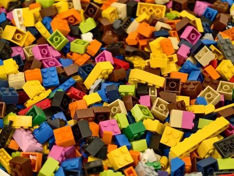 Bright Scattered Blocks Form Texture, Dynamic Collection Of Vibrant Bricks Stock Photos