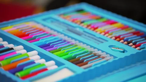 Bright set of multicolored felt-tip pens and pencils in a blue plastic box. 스톡 동영상 321371724