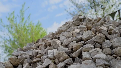 Bright sharp rocks roll downhill Video stock 90019645