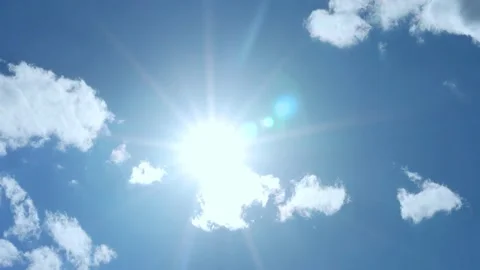 Bright Shining Sun, Macro, Clear Blue Azure Sky and Few White Fluffy Clouds on C 스톡 동영상 196221311