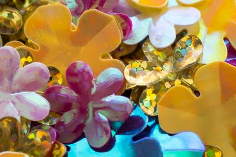 Bright shiny sequins in the shape of a flower Stock Photos