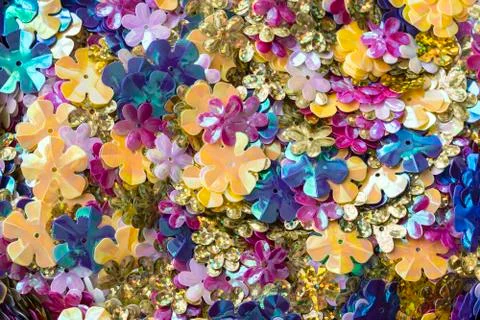 Bright shiny sequins in the shape of a flower Stock Photos