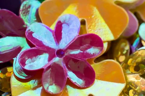 Bright shiny sequins in the shape of a flower Stock Photos