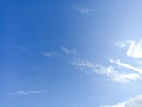 Bright sky background texture. Daytime air, bright blue sky and white clouds Stock Photos