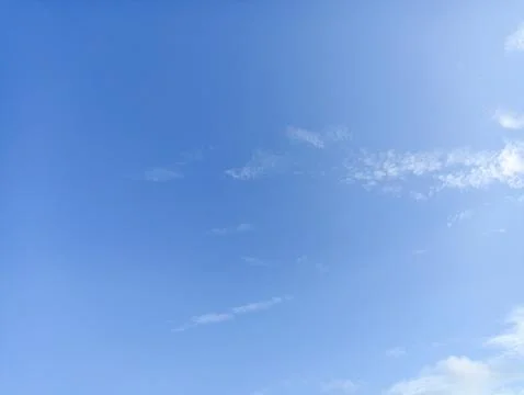 Bright sky background texture. Daytime air, bright blue sky and white clouds Stock Photos