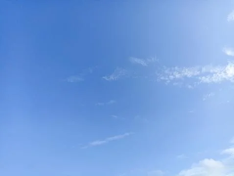 Bright sky background texture. Daytime air, bright blue sky and white clouds Stock Photos