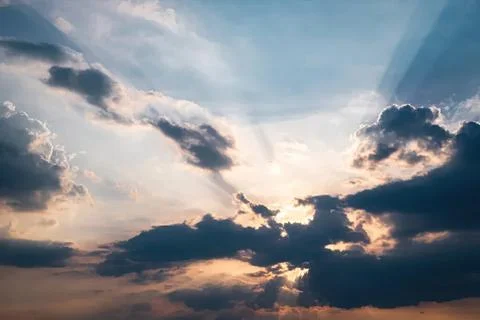 Bright sky with clouds and sun rays during sunset or sunrise Stock Photos