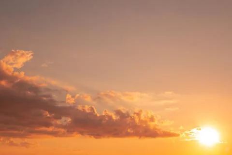 Bright sky with clouds. Yellow sunset on an autumn day. The beauty of nature Stockfoto's