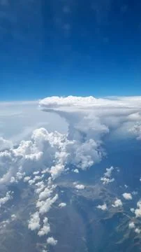 Bright Sky Framed by Fluffy Clouds. Nature Background. Clear Sky. Climate Con Stock Photos