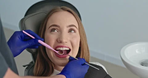 Bright Smile Evaluation: Dentist Using Periodontal Probe on Joyful Young Female Stock Footage 266394974