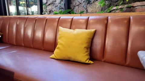 Bright sofa with pillow in cozy cafe setting Vídeos de archivo 341542772
