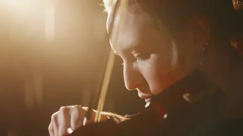 Bright soffits on stage and closeup of female violinist face, classic music Vídeo Stock 305443712