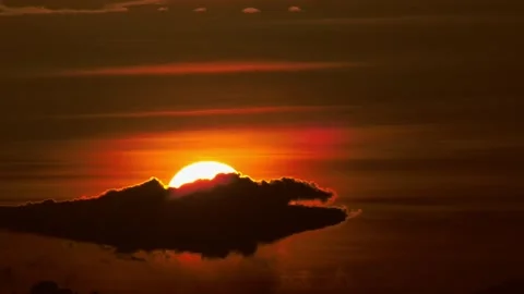 Bright Solar Disc Partly Hidden Behind a Dark Weather Formation 스톡 동영상 342899906