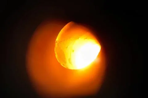 Bright solar eclipse with glowing moon and dark sky Stock Photos