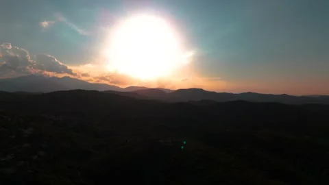 Bright Solar Eclipse over Dark Mountain Landscape Stock Footage 344441167