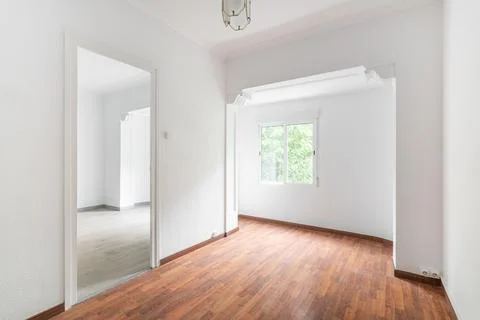 Bright, spacious empty white apartment with curly arch windows and luxury Stock Photos