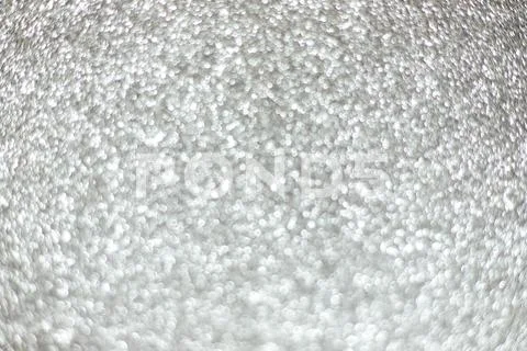 Bright sparkle silver background. Holiday and festive concept. Stock Photos