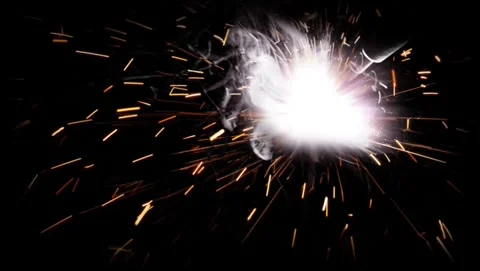 Bright sparkler explosion and glowing sparks burst on black background Vídeos de archivo 343547300