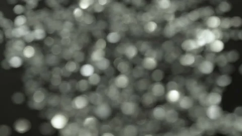 Bright sparkles on a dark background. Video stock 97003022
