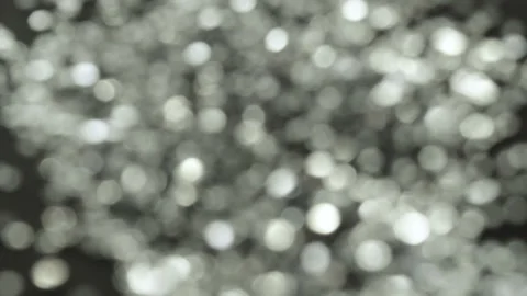 Bright sparkles on a dark background. Video stock 97003149