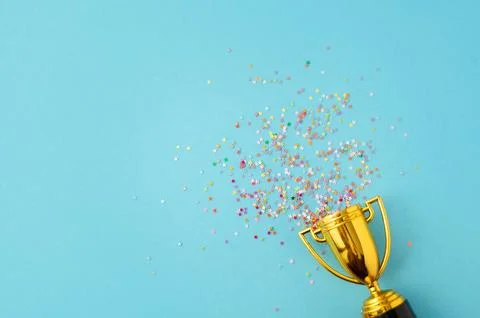 Bright sparkling background with winner cup. Stock Photos