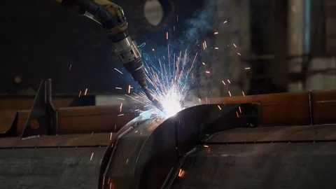 Bright sparks from robot welding Stock Footage