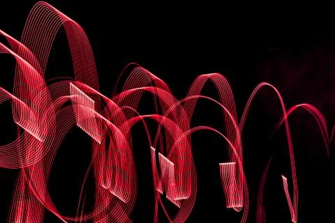 Bright spiral patterns from light strips on a black background Foto stock