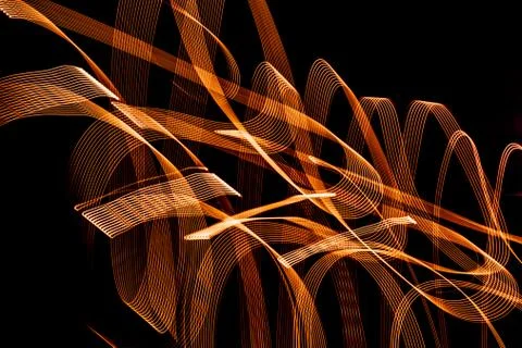 Bright spiral patterns from light strips on a black background Stock Photos