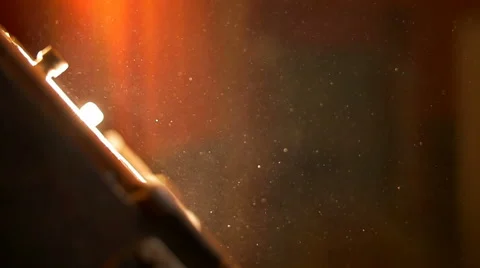 The bright spotlight on the background of the dust particle. Real time capture Stock-Footage 61500790