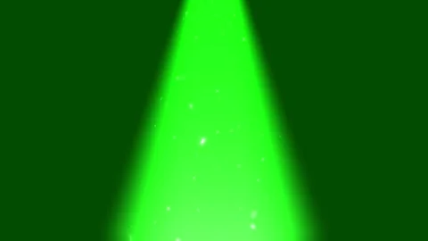 Bright spotlight beams projecting downward onto falling glitter particles Video stock 340940846