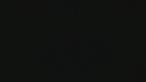 A bright spotlight illuminates a disco background with vertical stripes and Stock Footage 184475291