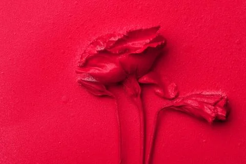 Bright spray painted red eustoma flower on a red paper background. Stock Photos