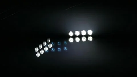 Bright stadium floodlights illuminating the dark night sky at a sports arena. Stock Footage 344963030